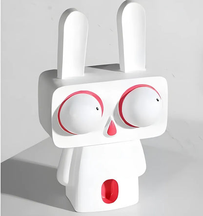 Angled view of the large white pop art rabbit figurine with big red-rimmed eyes standing on a clean white surface