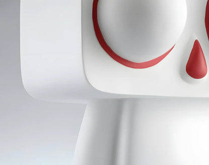 Close up macro shot of the smooth matte white resin finish and clean geometric lines on the pop art rabbit sculpture