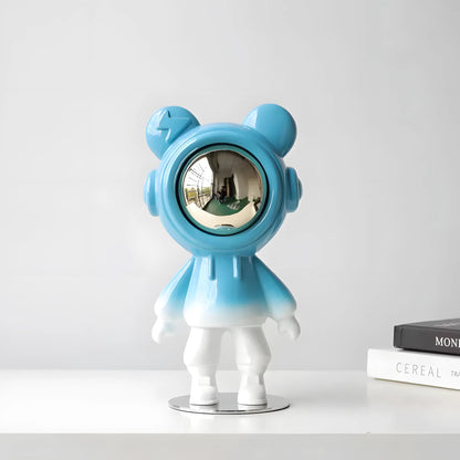 Front view of the contemporary glossy blue astronaut bear art piece showing the reflective silver chrome visor