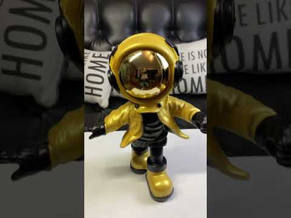 Blue astronaut figurine with ball