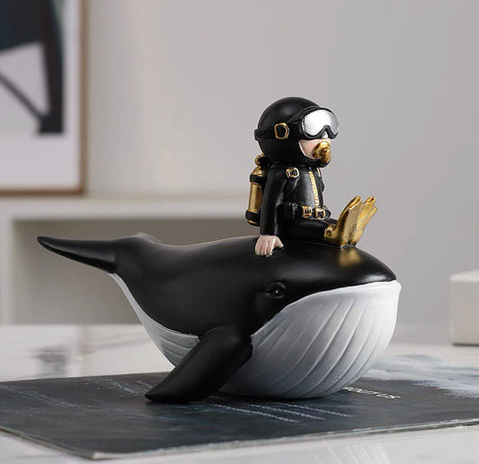 Statuette of a diver on a whale