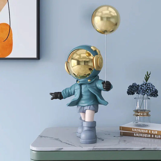 Blue astronaut figurine with ball