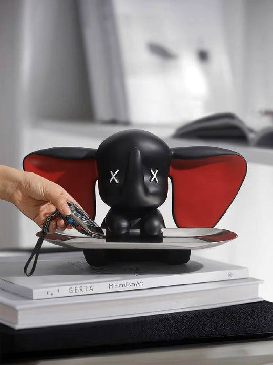 Black elephant figurine with tray