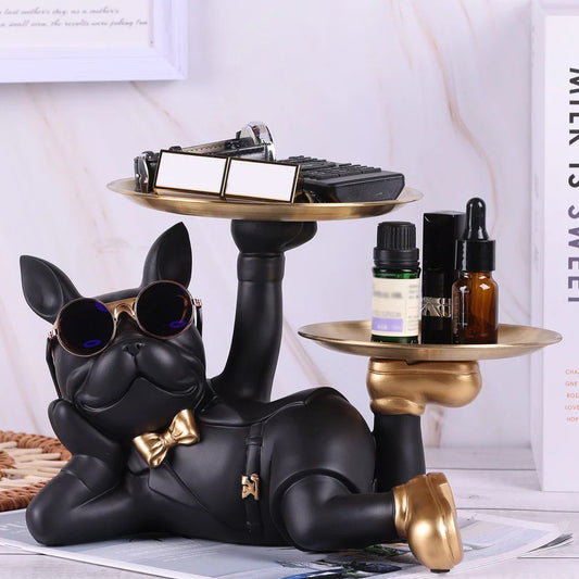 Figurine of a dog wearing sunglasses with two trays in golden shoes