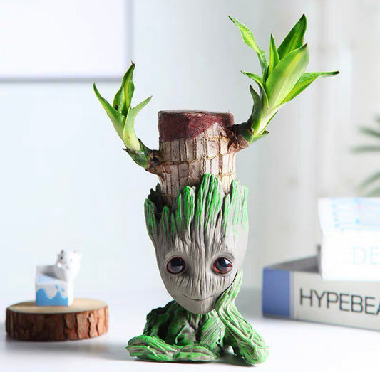 Vase, plant pot, plant with hand under chin